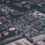 Dynamic Metal Recycling | Close-up of a computer motherboard showing various electronic components, emphasizes the importance of electronics recycling in recovering valuable materials.